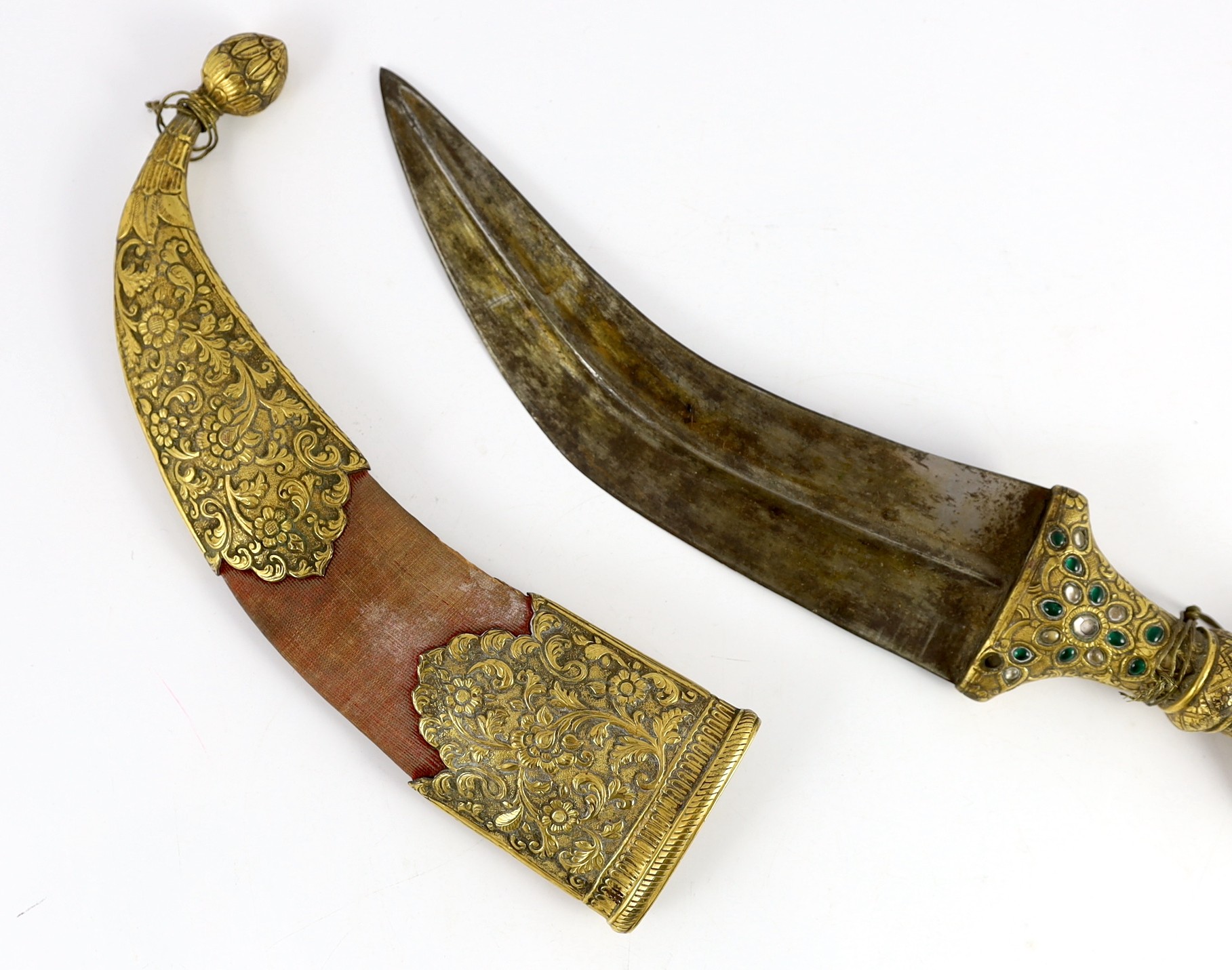 An Indian gilt copper and paste mounted dagger (jambiya), Kutch, 19th century, dagger 33cm long, scabbard 22cm long